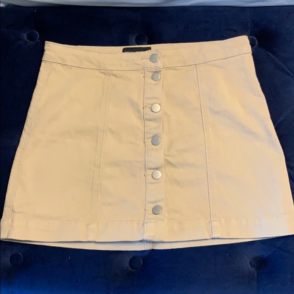 Tan stretch mini skirt with button down detail